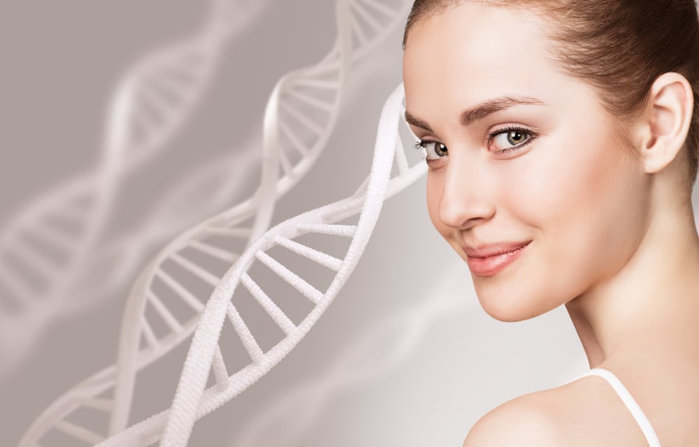 A woman smiling with DNA chains in the background