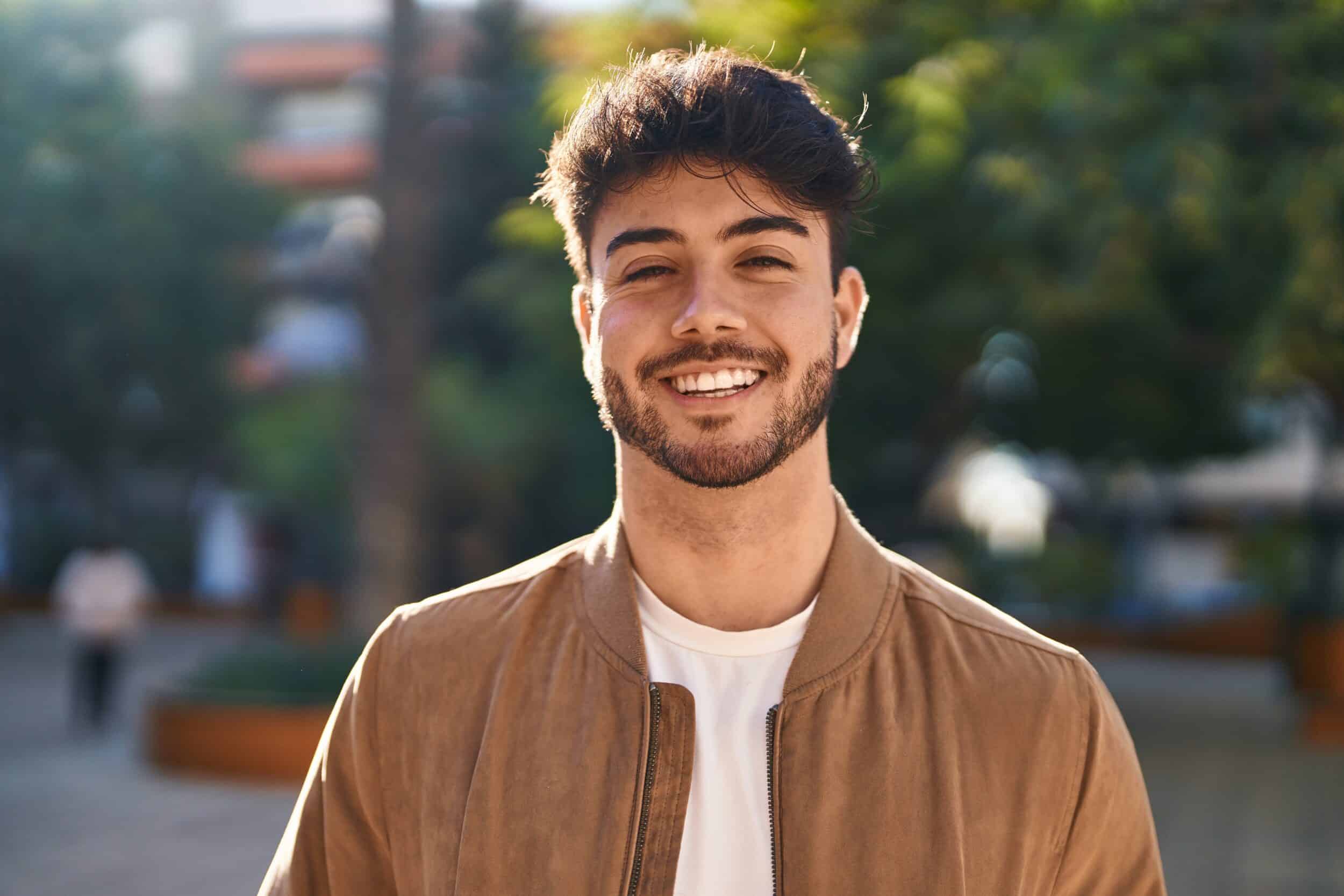 Man smiling after penile enhancement with fillers in Chicago