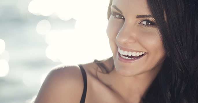 Smiling woman representing JUVÉDERM results at Old Town Med Spa.